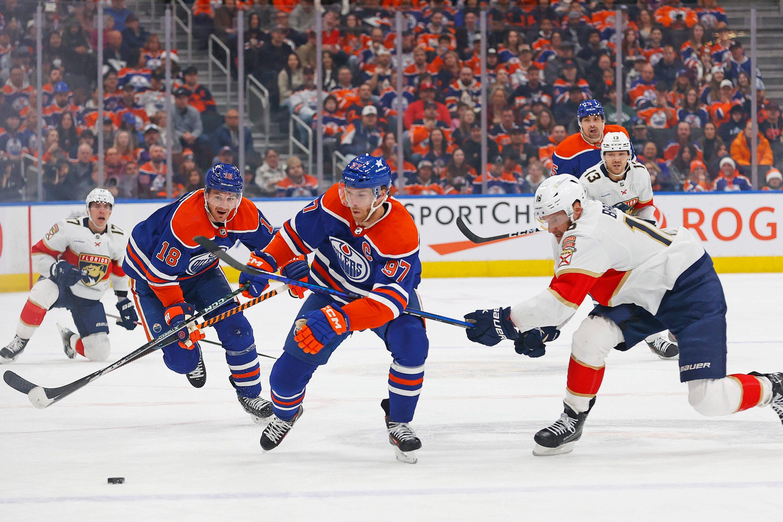 Edmonton Oilers forward Connor McDavid skates passed Aleksander Barkov of the Florida Panthers.