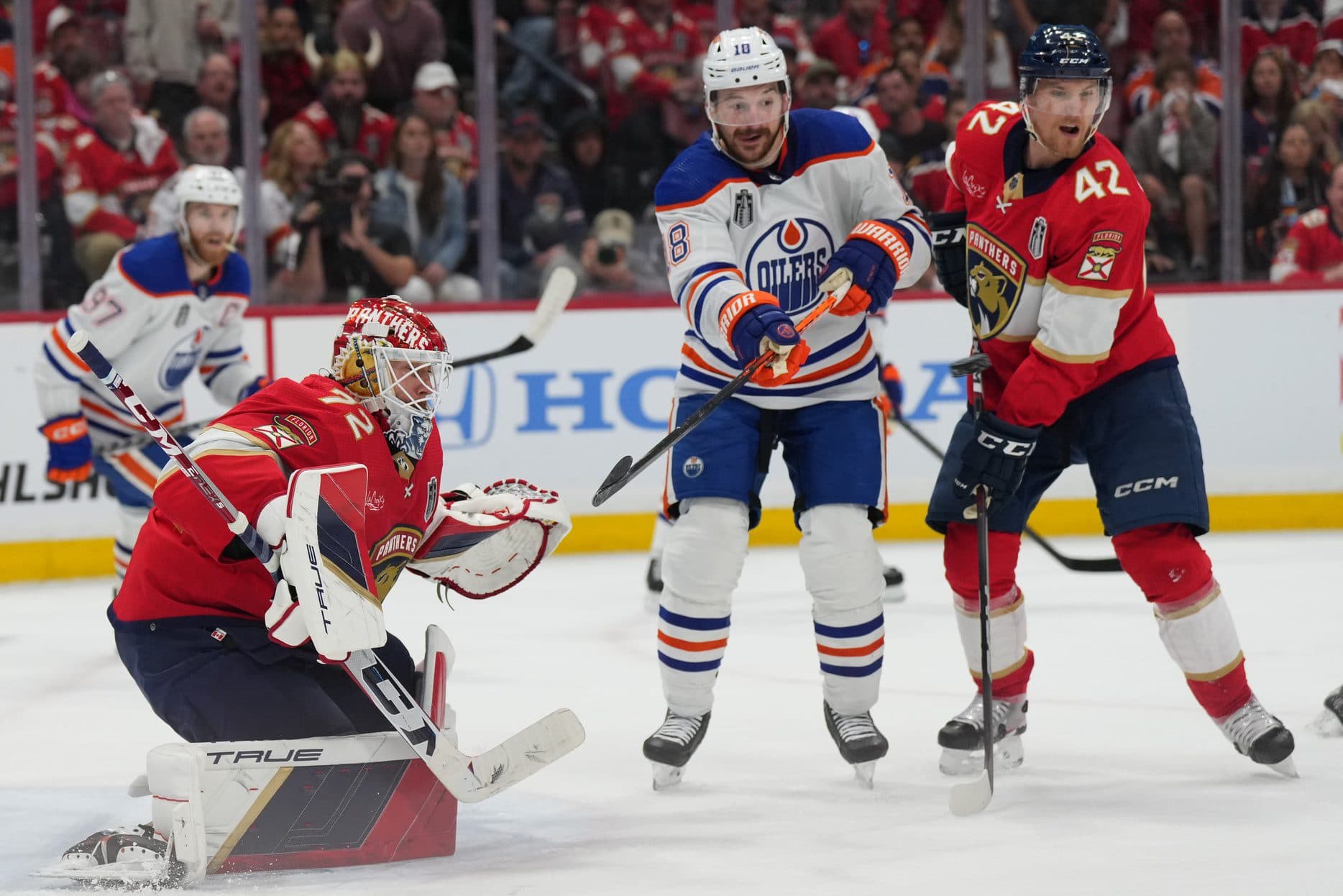 Florida Panthers goaltender Sergei Bobrovsky stops a shot while Gustav Forsling defends Edmonton Oilers winger Zach Hyman for BetMGM bonus code 6.12