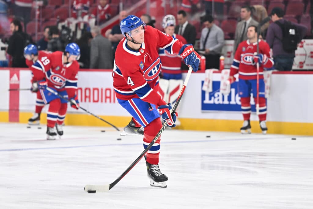 MONTREAL, CANADA - APRIL 16:  Logan Mailloux #94 of the Montreal Canadiens shoots the puck during warmups prior to the game against the Detroit Red Wings at the Bell Centre on April 16, 2024 in Montreal, Quebec, Canada.  The Detroit Red Wings defeated the Montreal Canadiens 5-4 in a shootout.  (Photo by Minas Panagiotakis/Getty Images)