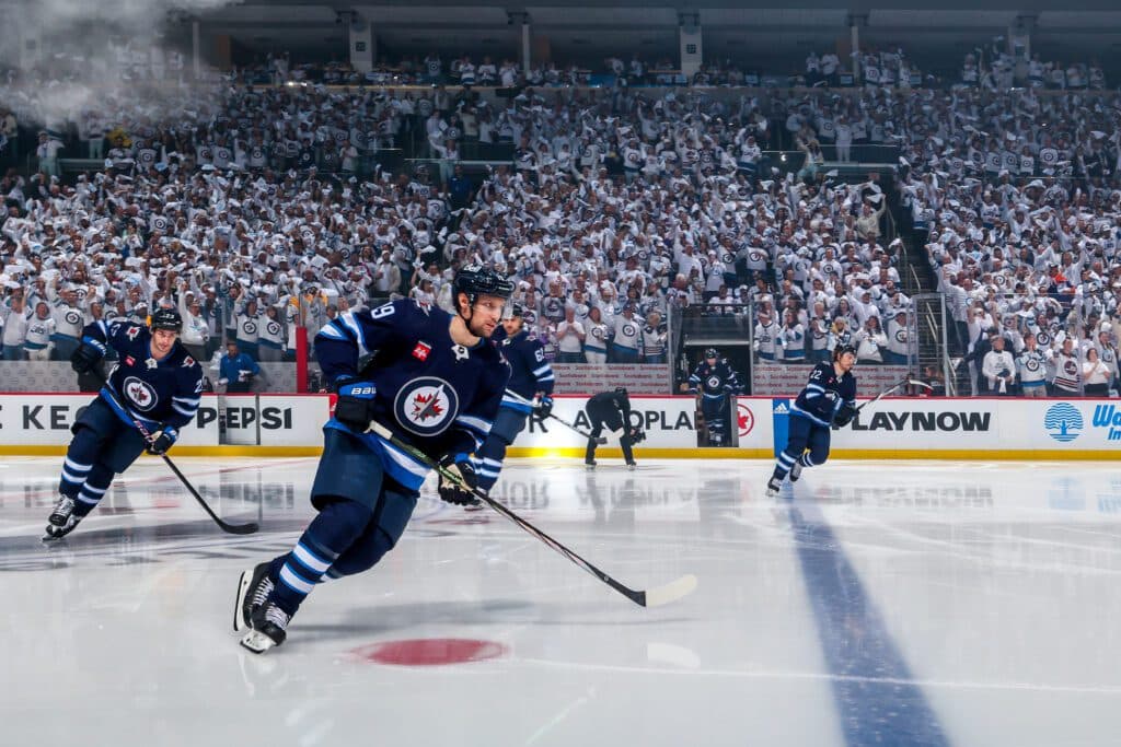 WINNIPEG, CANADA - APRIL 30: David Gustafsson #19, Sean Monahan #23, and Mason Appleton #22 of the Winnipeg Jets hit the ice prior to NHL action against the Colorado Avalanche in Game Five of the First Round of the 2024 Stanley Cup Playoffs at Canada Life Centre on April 30, 2024 in Winnipeg, Manitoba, Canada. (Photo by Jonathan Kozub/NHLI via Getty Images)