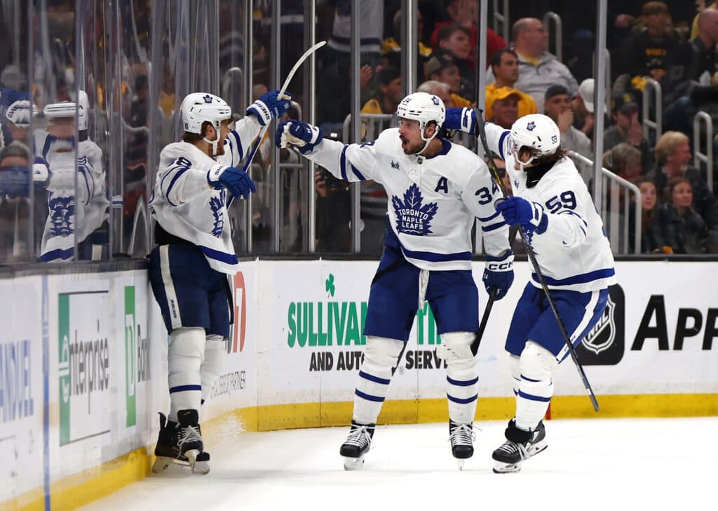 BOSTON, MASSACHUSETTS - MAY 04: William Nylander #88 of the Toronto Maple Leafs celebrates with Auston Matthews #34 and Tyler Bertuzzi #59 after scoring a goal on Jeremy Swayman #1 of the Boston Bruins during the third period in Game Seven of the First Round of the 2024 Stanley Cup Playoffs at TD Garden on May 04, 2024 in Boston, Massachusetts. (Photo by Maddie Meyer/Getty Images)