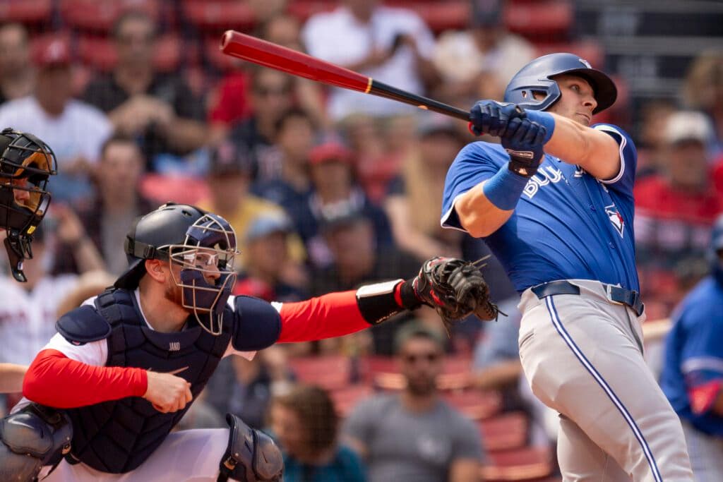 BOSTON, MASSACHUSETTS - AUGUST 26: Danny Jansen #28 of the Boston Red Sox catches as Daulton Varsho #25 of the Toronto Blue Jays bats during the second inning of game one of a doubleheader against the Toronto Blue Jays on August 26, 2024 at Fenway Park in Boston, Massachusetts. Jansen is the first MLB player to play for both teams in one game as the Red Sox and Toronto Blue Jays finish a matchup that was suspended by rain on June 26.  (Photo by Maddie Malhotra/Boston Red Sox/Getty Images)