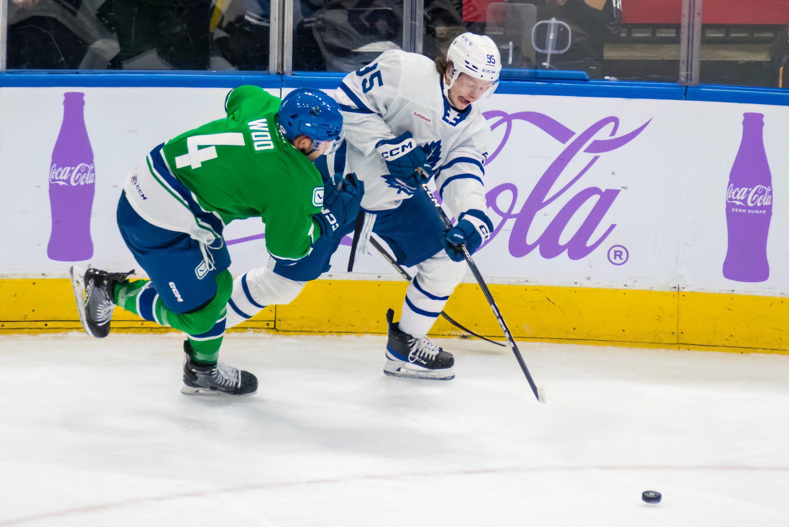 Canucks place Guillaume Brisebois and Jett Woo on waivers