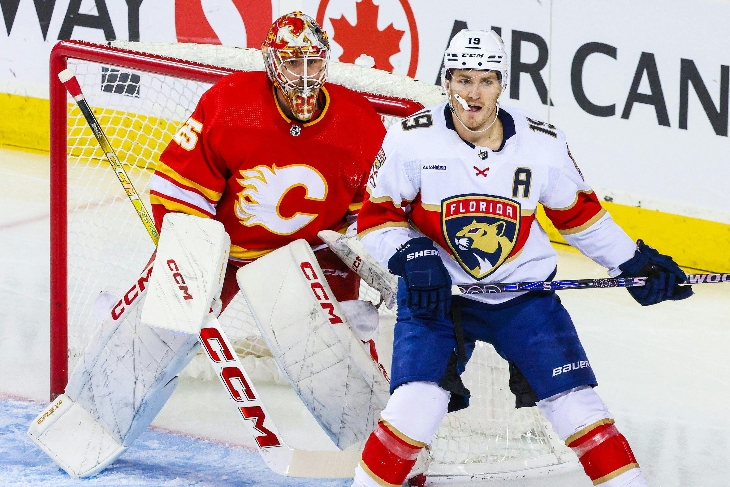 Florida Panthers forward Matthew Tkachuk and Calgary Flames goaltender Jacob Markstrom