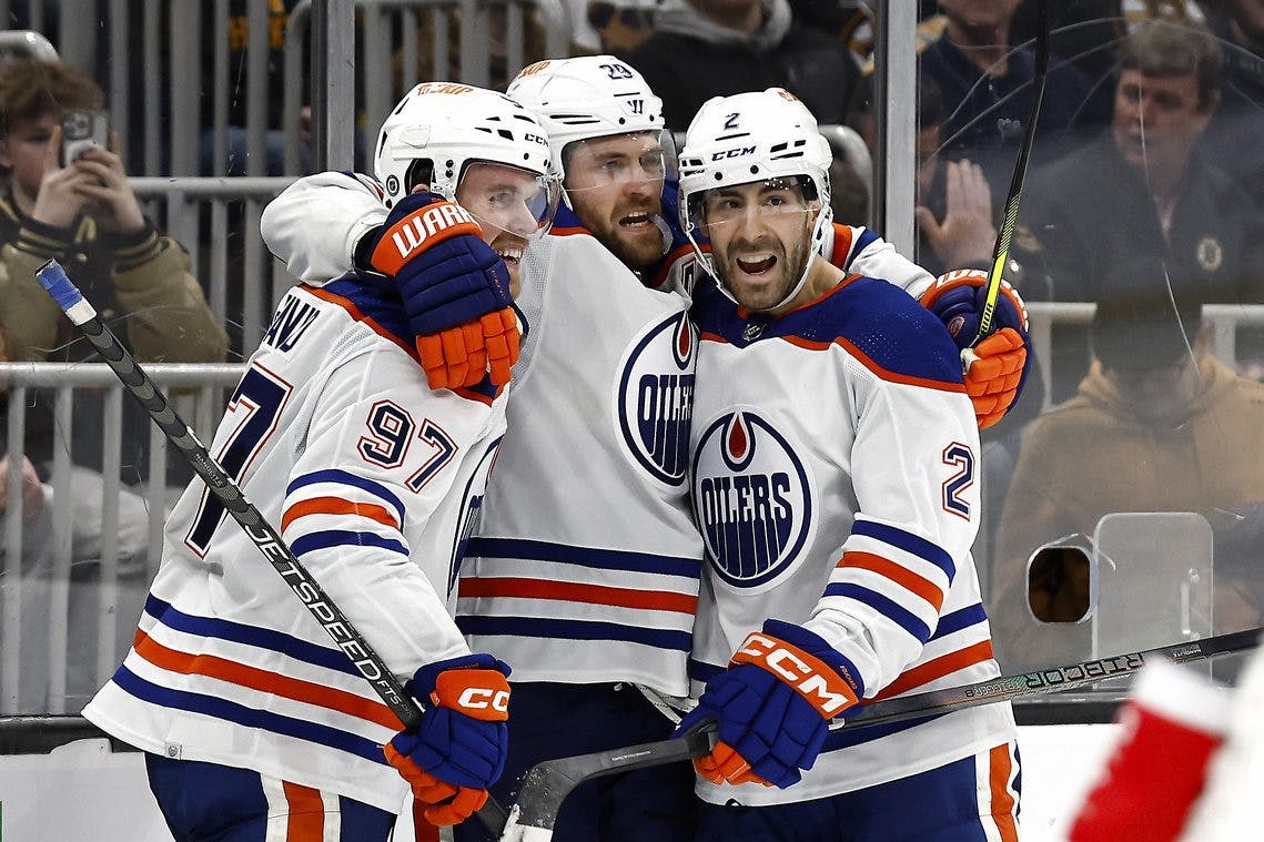 Edmonton Oilers players Connor McDavid, Leon Draisaitl and Evan Bouchard