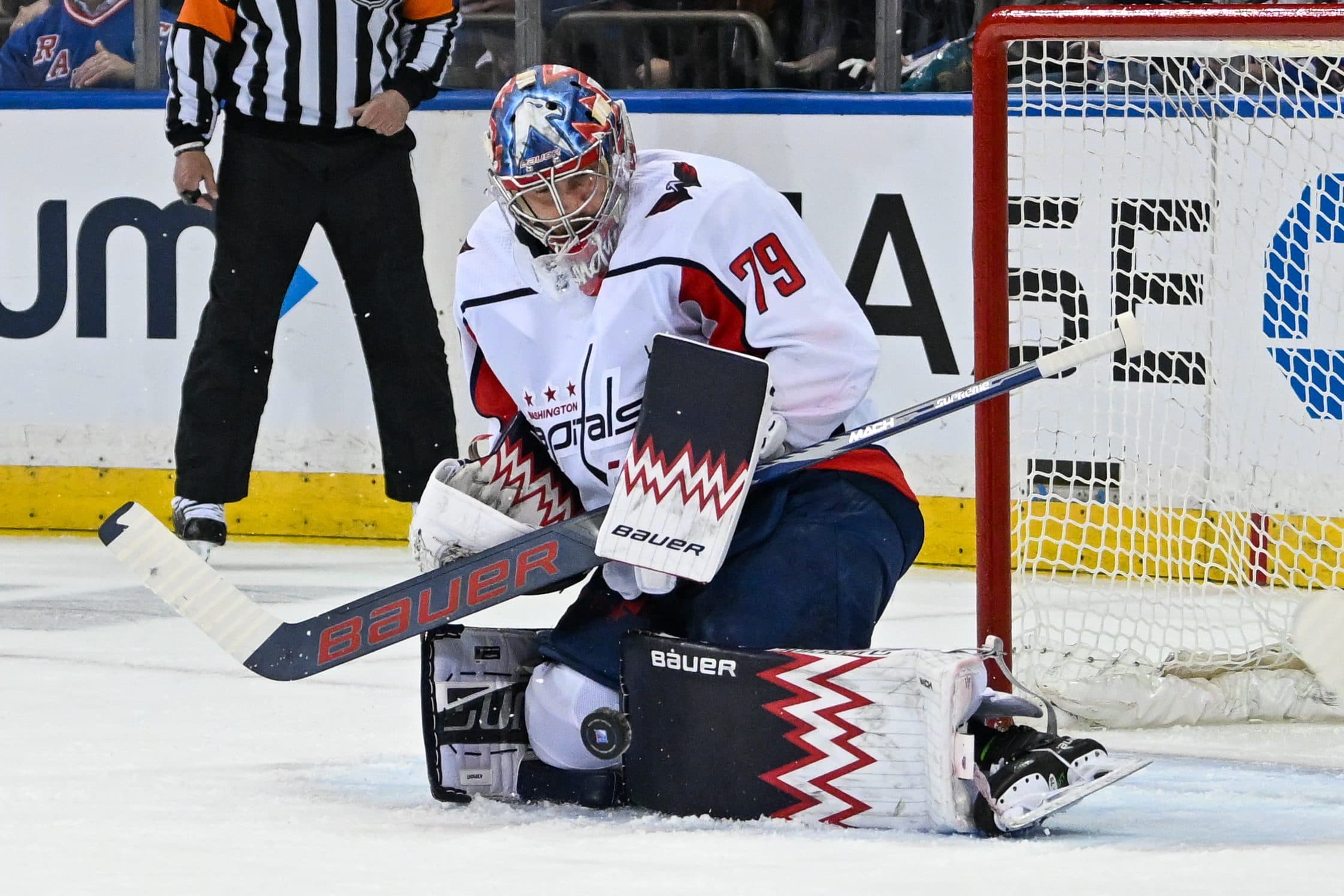 Capitals’ Charlie Lindgren shoots puck into own net