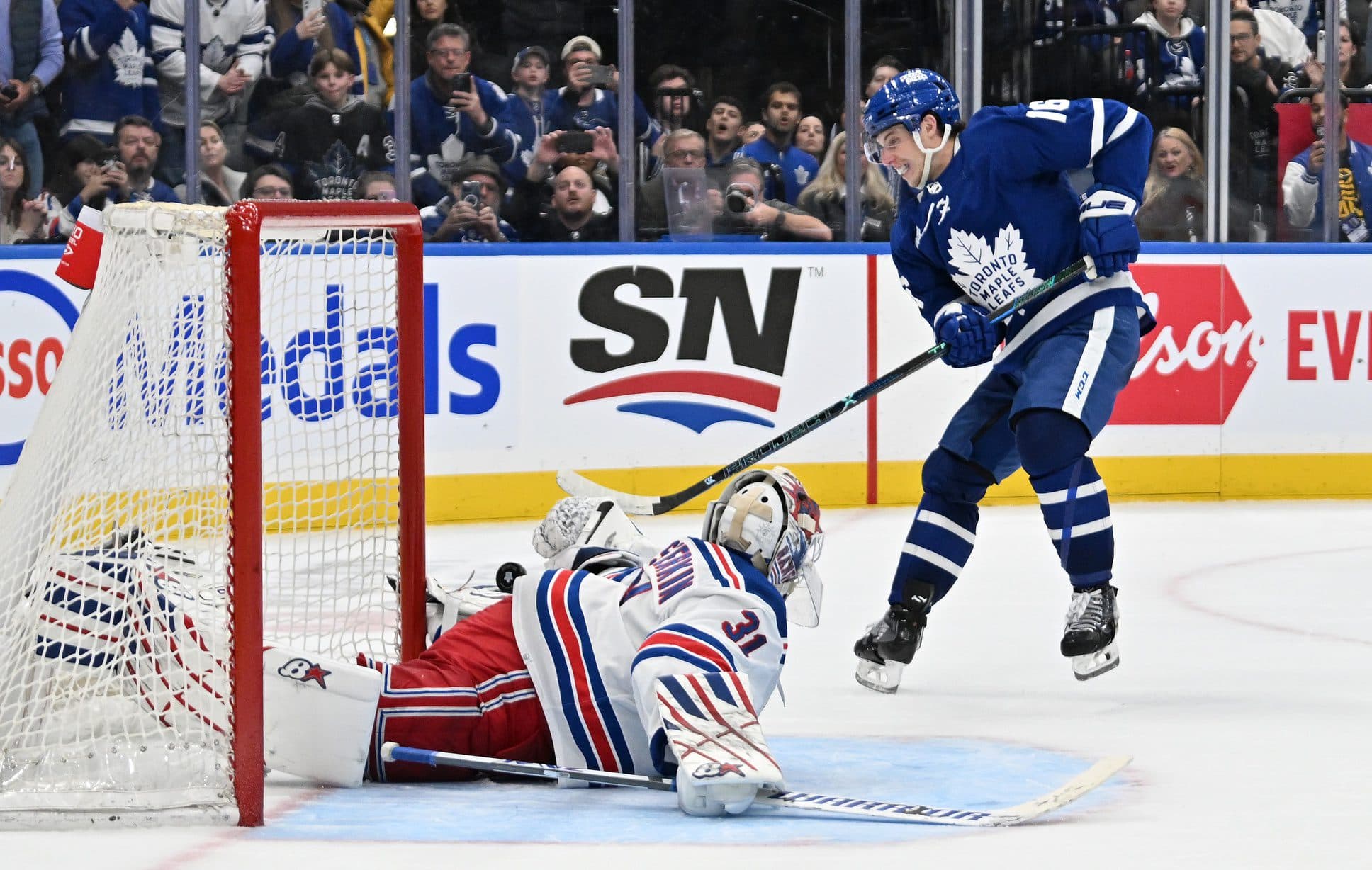 Toronto Maple Leafs forward Mitch Marner (16) scores a goal past New York Rangers goalie Igor Shesterkin (31) in the overtime shootout at Scotiabank Arena.