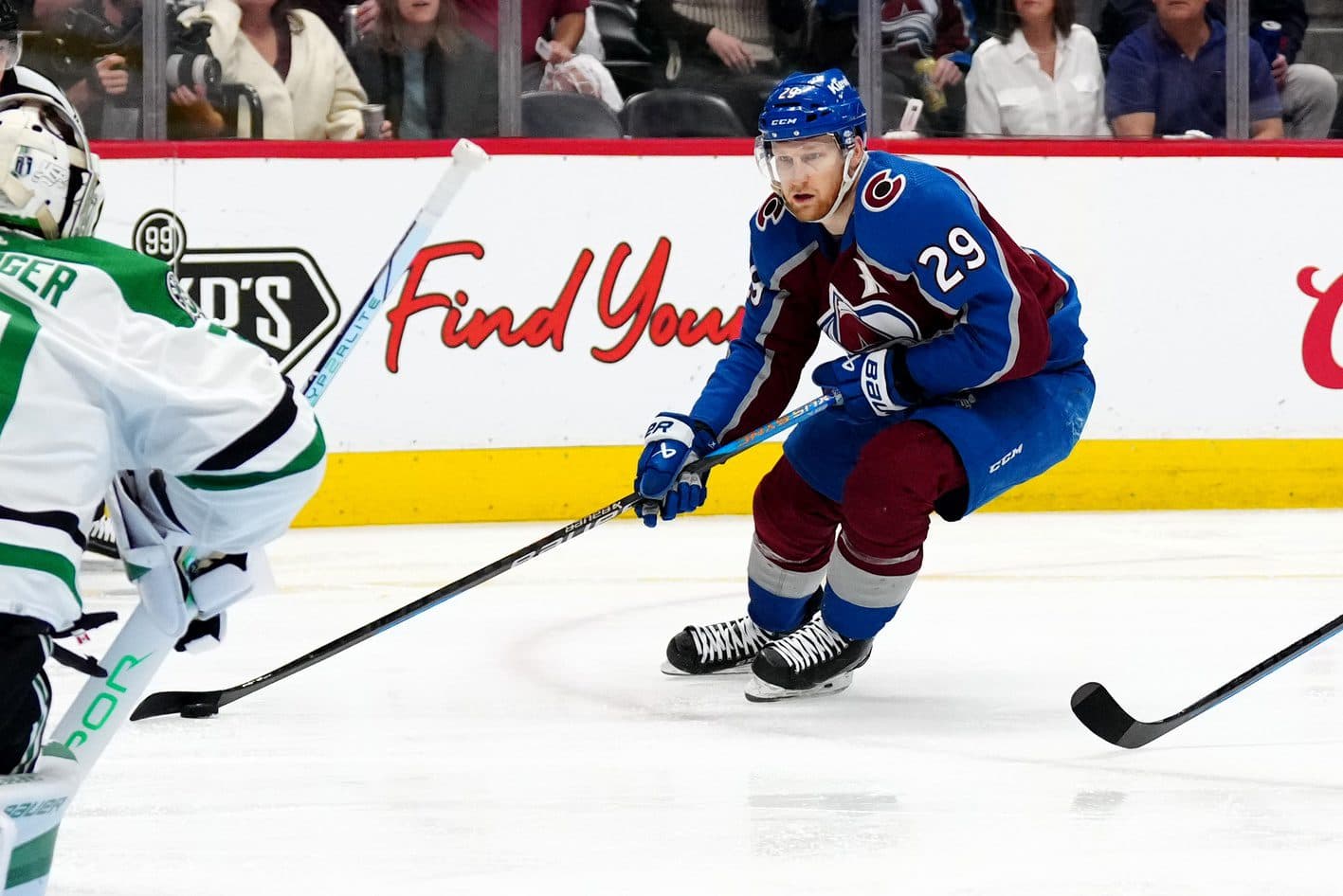 Colorado Avalanche center Nathan MacKinnon (29) skates towards Dallas Stars goaltender Jake Oettinger (29) in the second period in game six of the second round of the 2024 Stanley Cup Playoffs at Ball Arena