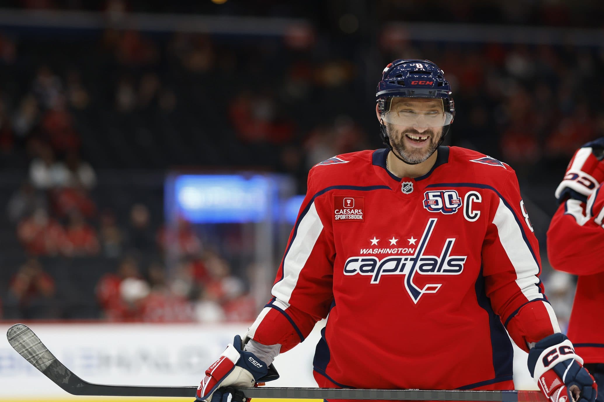 Washington Capitals left wing Alex Ovechkin (8) smiles during a stoppage in play against the Columbus Blue Jackets in the second period at Capital One Arena.