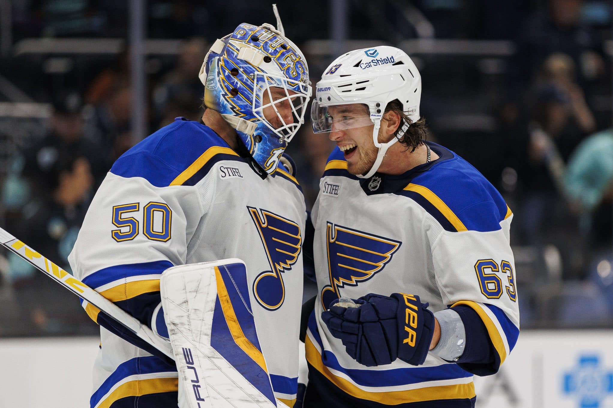 St. Louis Blues defenseman Philip Broberg (6) speaks to goaltender Jordan Binnington (50) after the game against the Seattle Kraken at Climate Pledge Arena