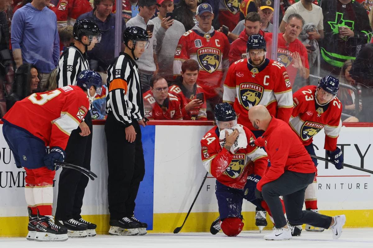 Adam Boqvist of the Panthers leaves the game against the Bruins after shooting the puck in the face