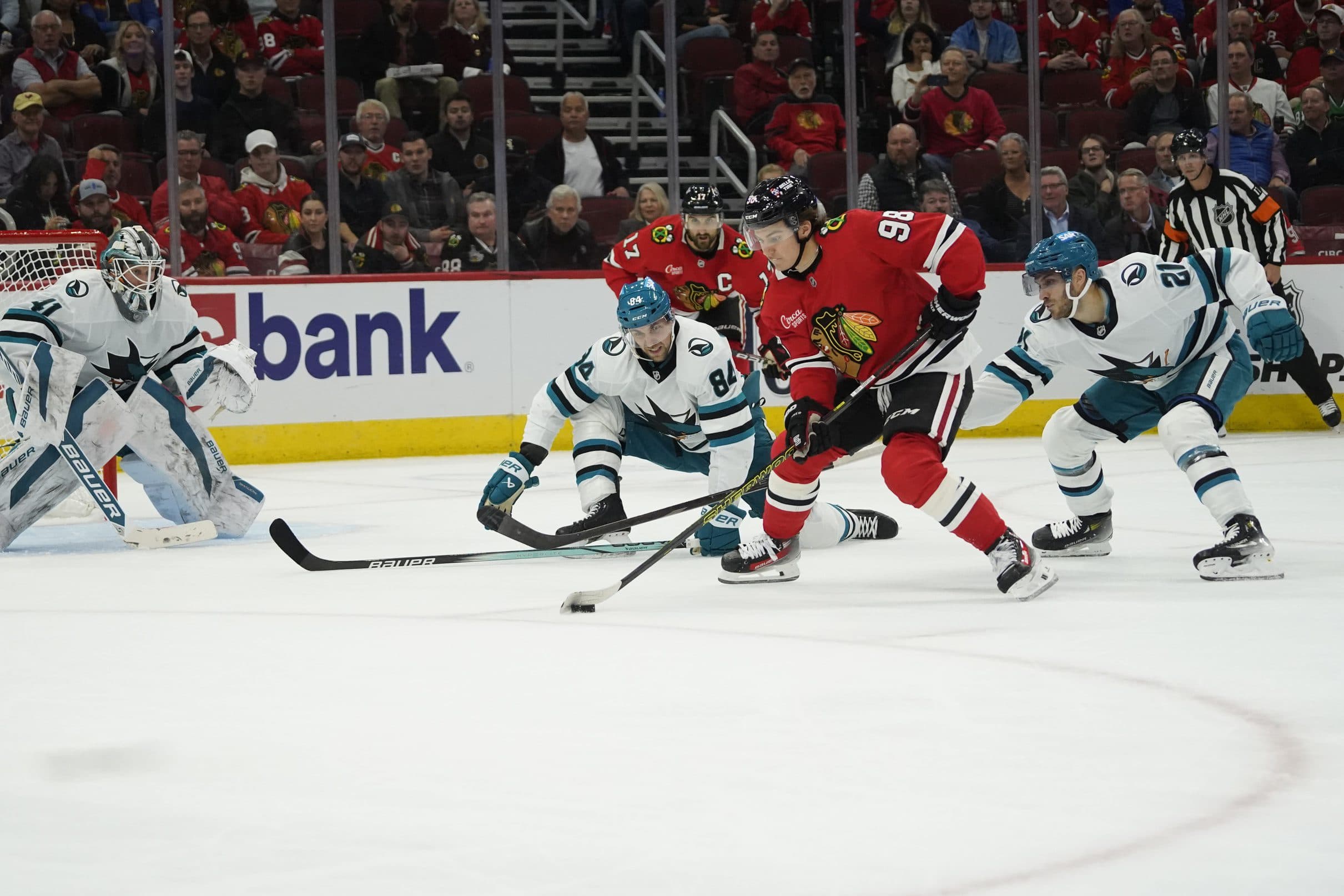 San Jose Sharks defenseman Jan Rutta (84) defends Chicago Blackhawks center Connor Bedard (98) during the third period at United Center