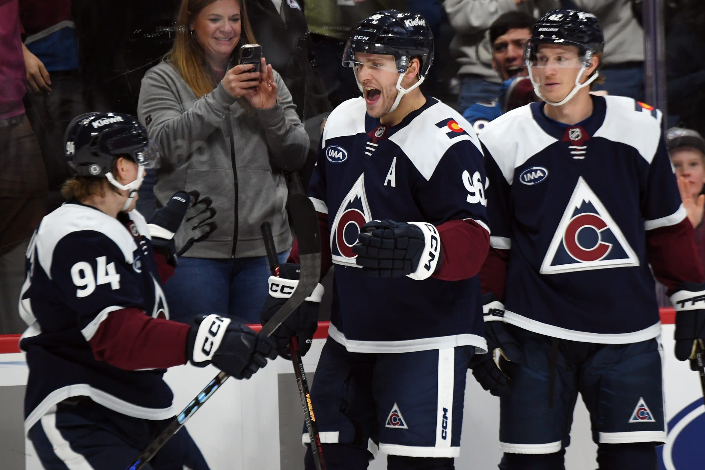 Colorado Avalanche right wing Mikko Rantanen (96) celebrates with left wing Joel Kiviranta (94) after a goal during the second period against the Nashville Predators at Ball Arena.