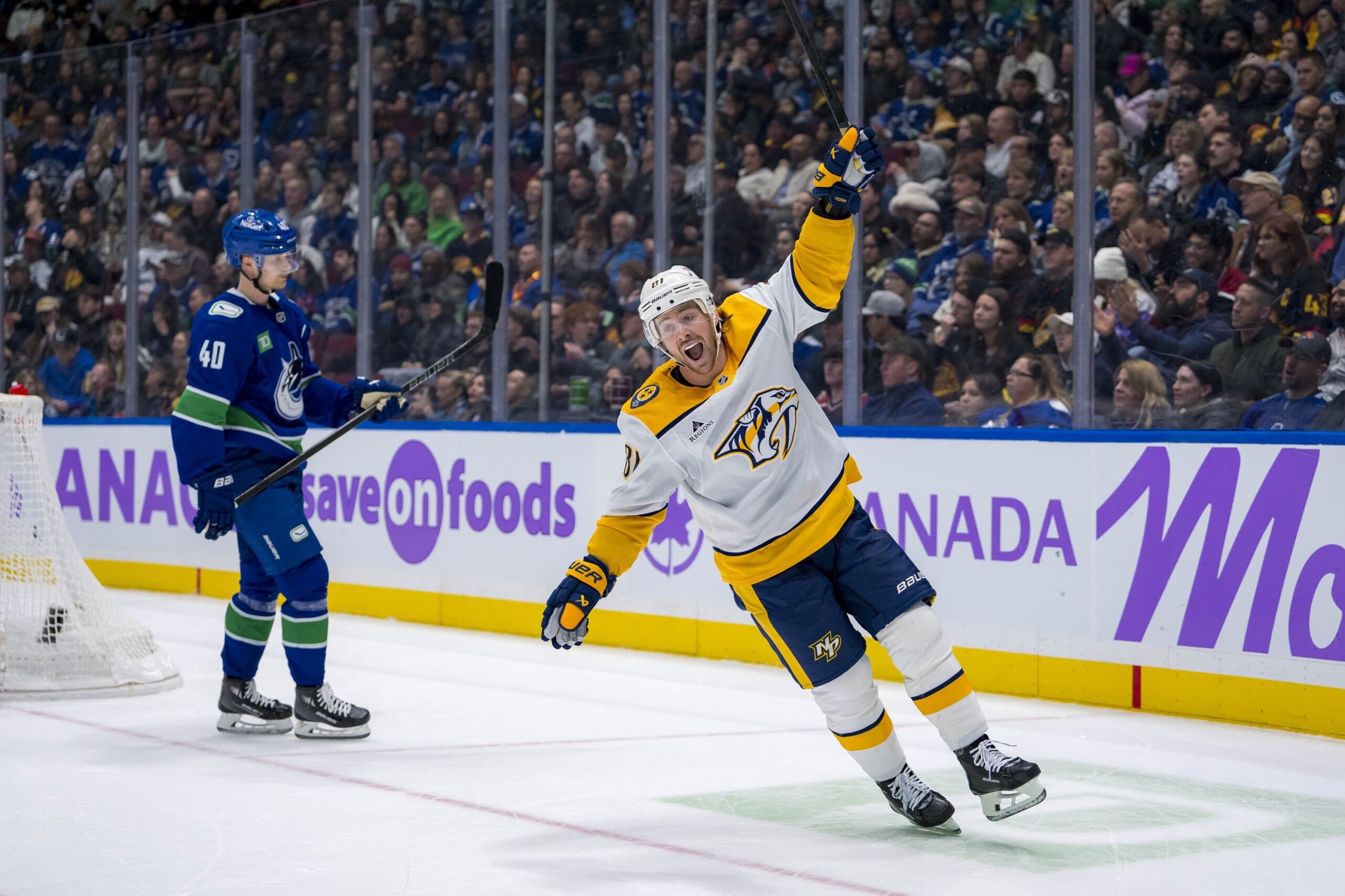 Nashville Predators winger Jonathan Marchessault and Vancouver Canucks center Elias Pettersson.