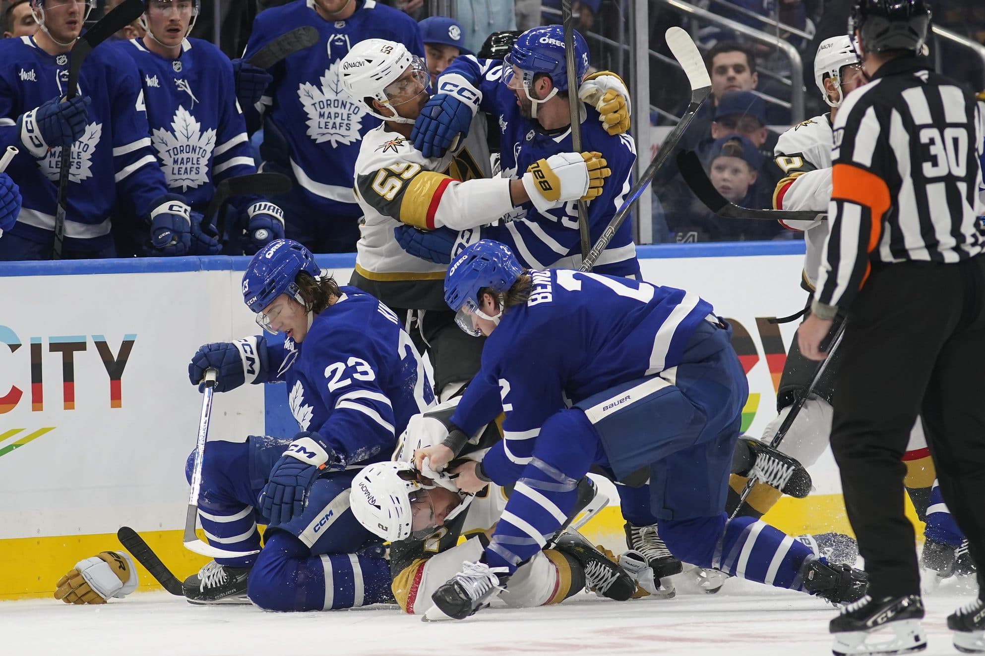 Toronto Maple Leafs and Vegas Golden Knights players fight after Zach Whitecloud's hit on Matthew Knies.