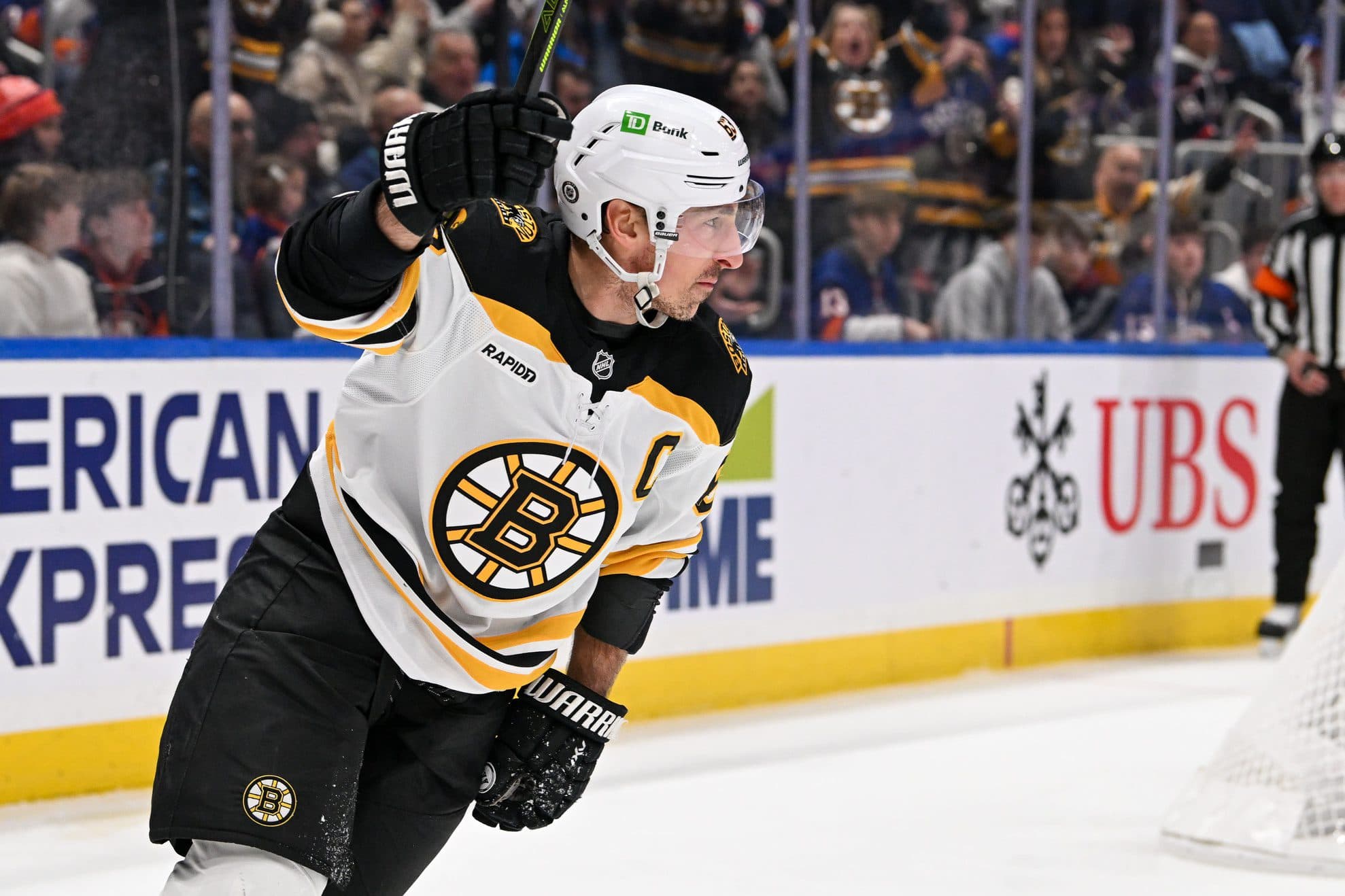 Boston Bruins left wing Brad Marchand (63) celebrates his second goal against the New York Islanders during the first period at UBS Arena.