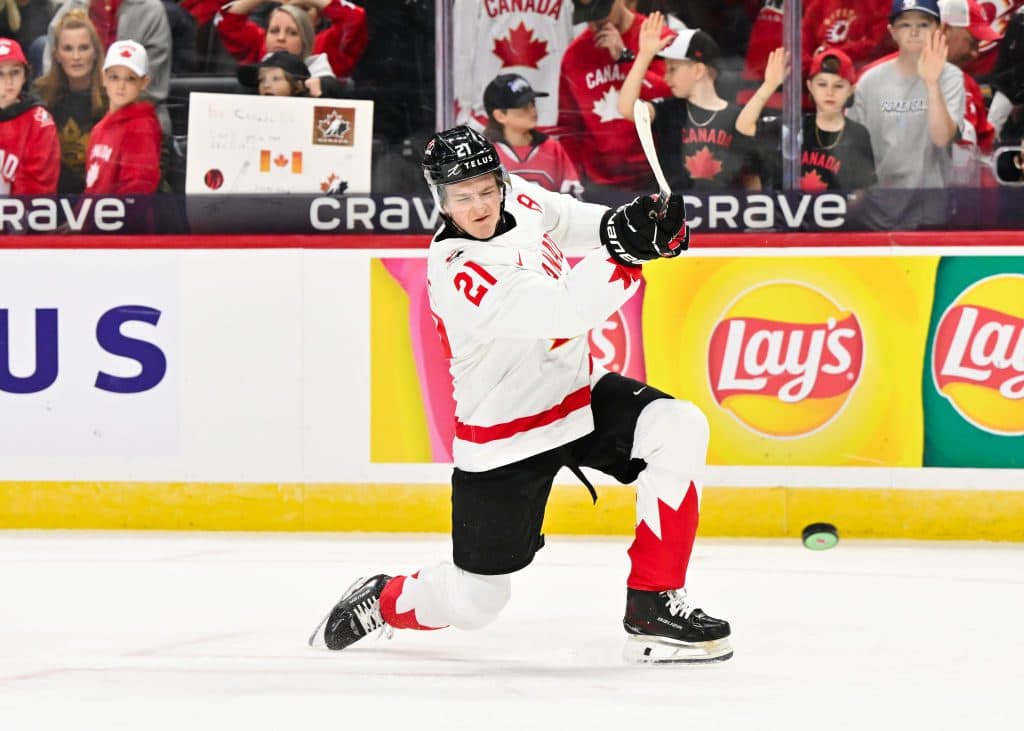 Calum Ritchie #21 of Team Canada shoots the puck in the warmups prior to the Group A match against Team Finland during the 2025 IIHF World Junior Championship at Canadian Tire Centre on December 26, 2024 in Ottawa, Ontario, Canada. Team Canada defeated Team Finland 4-0.