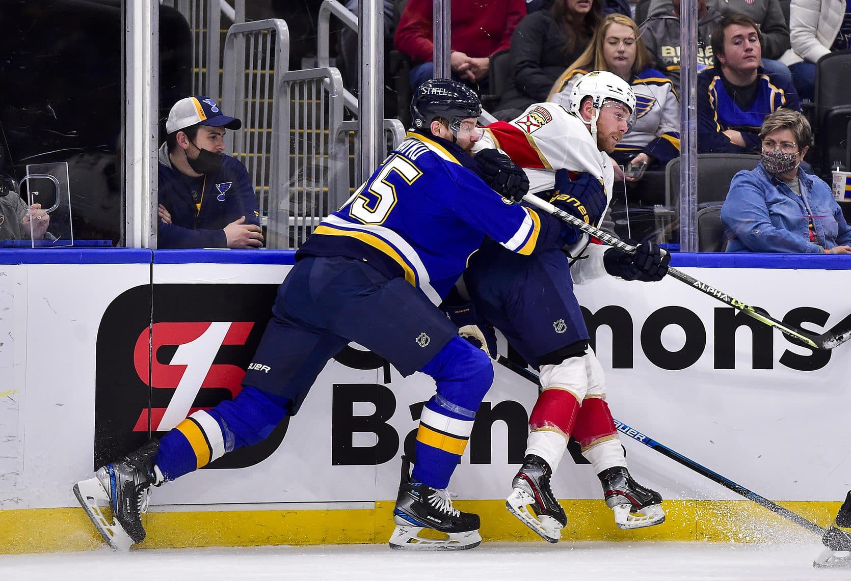 St. Louis Blues defenseman Colton Parayko (55) checks Florida Panthers center Sam Bennett (9) during the first period at Enterprise Center.