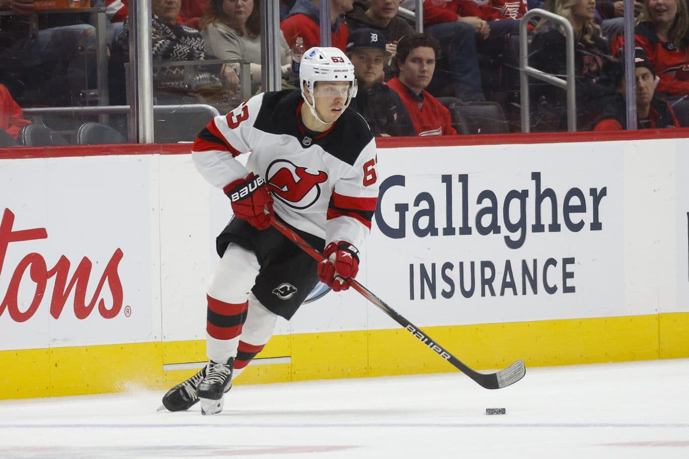 New Jersey Devils left wing Jesper Bratt (63) handles the puck during the first period against the Detroit Red Wings at Little Caesars Arena.