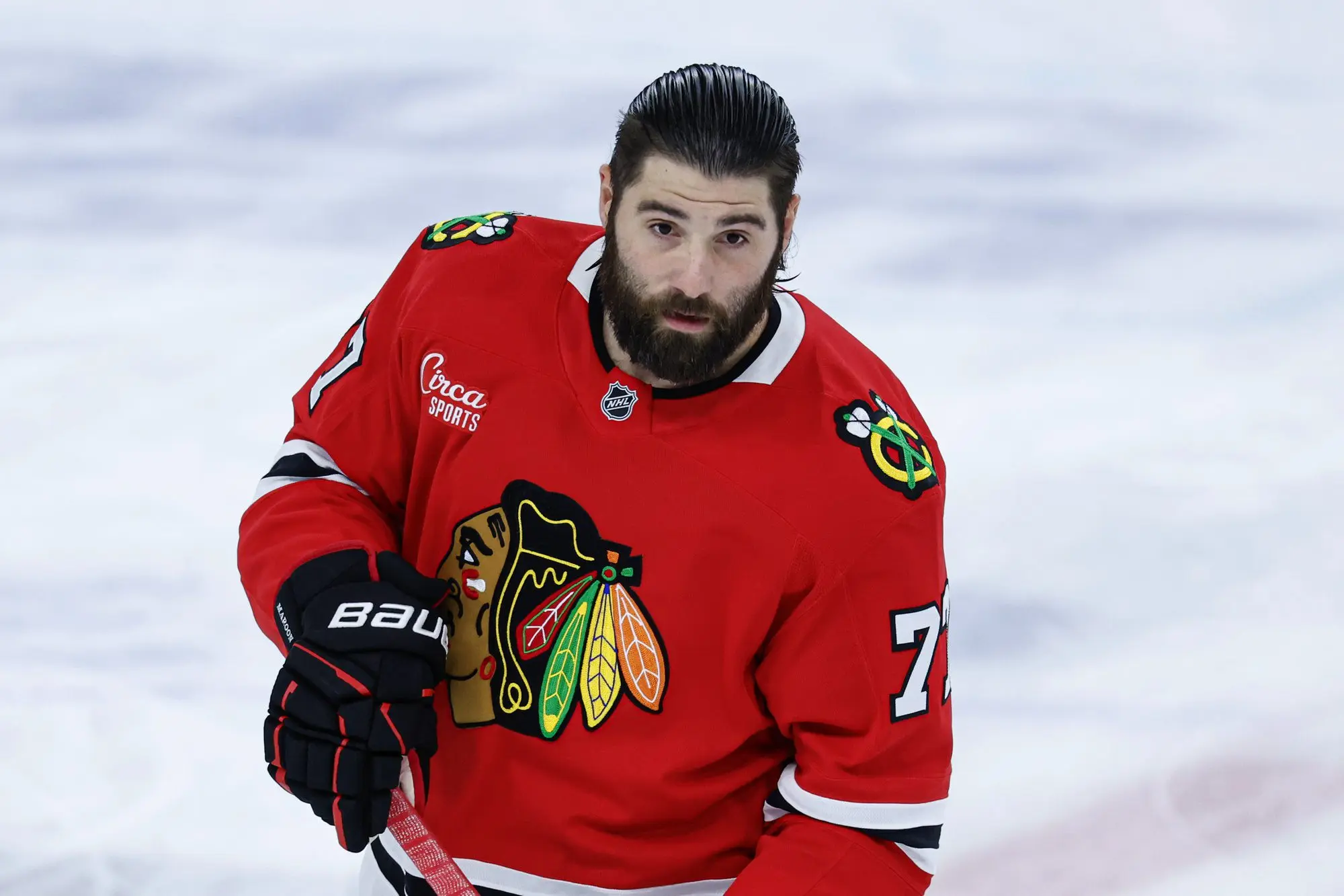 Chicago Blackhawks left wing Patrick Maroon (77) warms up before a game against the Boston Bruins at United Center.