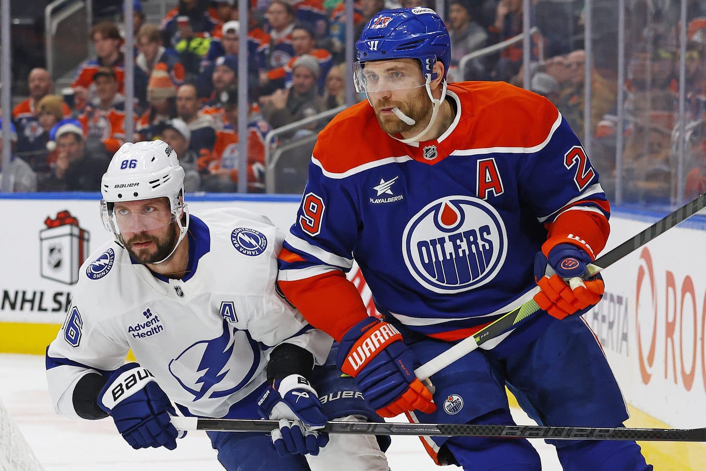 Tampa Bay Lightning forward Nikita Kucherov (86) and Edmonton Oilers forward Leon Draisaitl (29) look for a loose puck during the second period at Rogers Place.