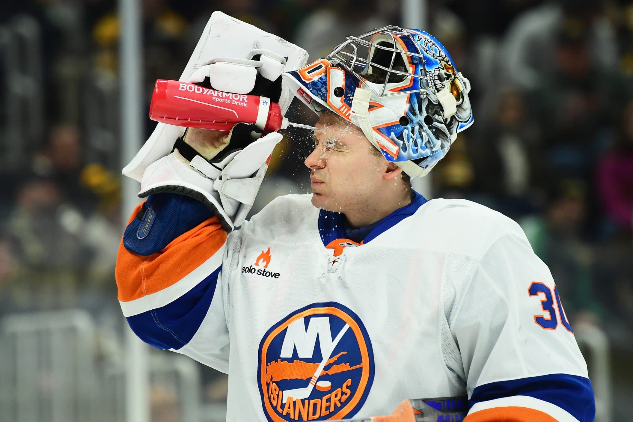 New York Islanders goaltender Ilya Sorokin (30) squirts his face with water before a game against the Boston Bruins at TD Garden.