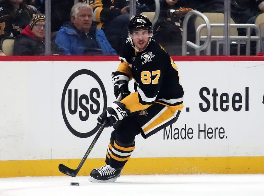 Pittsburgh Penguins center Sidney Crosby (87) skates with the puck against the Seattle Kraken during the first period at PPG Paints Arena.