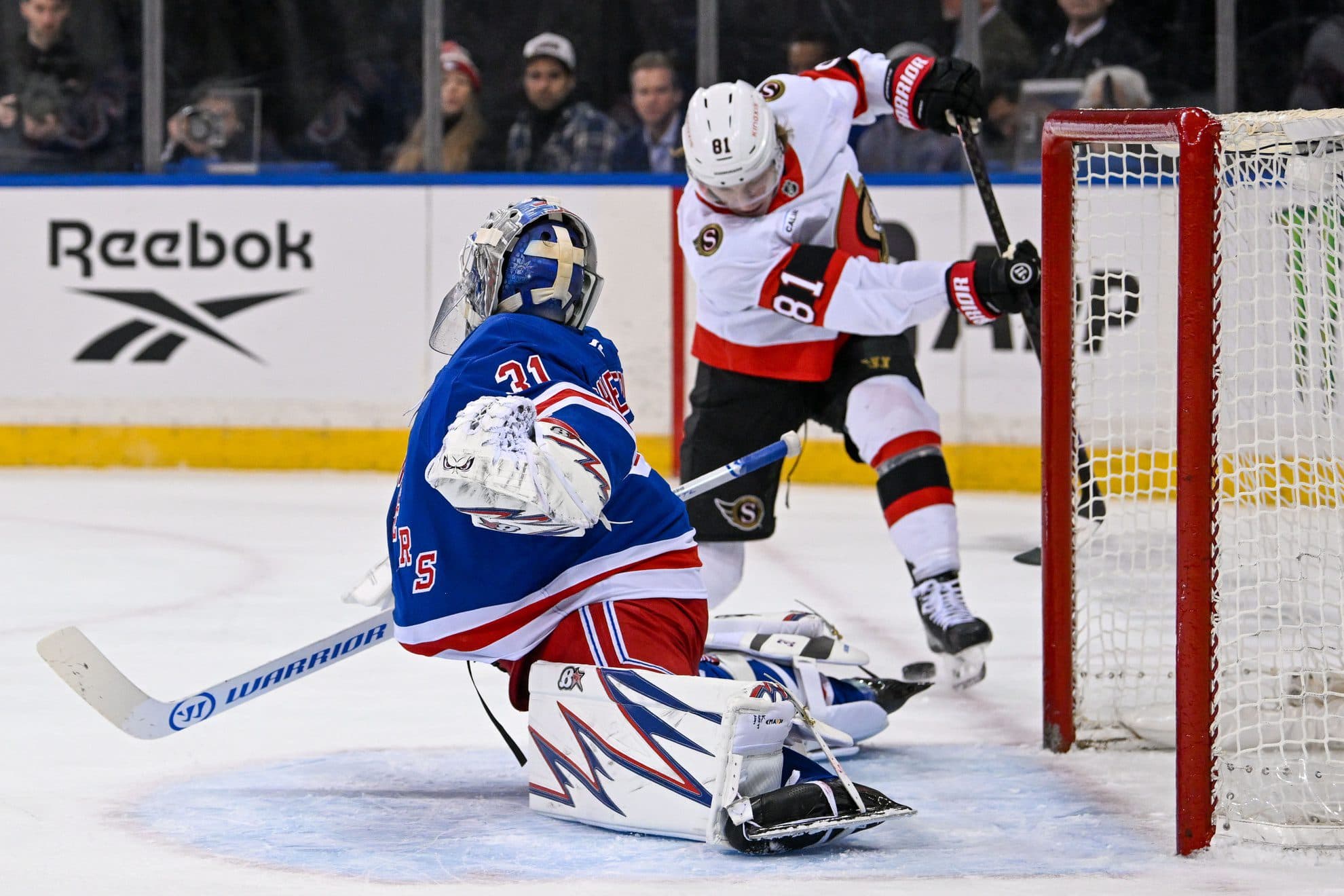 Ottawa Senators right wing Adam Gaudette (81) attemtps a shot on New York Rangers goaltender Igor Shesterkin (31) during the first period at Madison Square Garden.