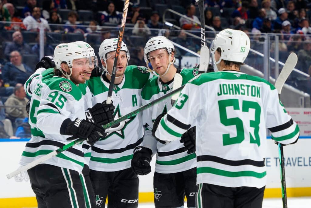 ELMONT, NEW YORK - FEBRUARY 23:  Jason Robertson #21 of the Dallas Stars is congratulated by his teammates after scoring his third goal against the New York Islanders during the second period at UBS Arena on February 23, 2025 in Elmont, New York. (Photo by Mike Stobe/NHLI via Getty Images)