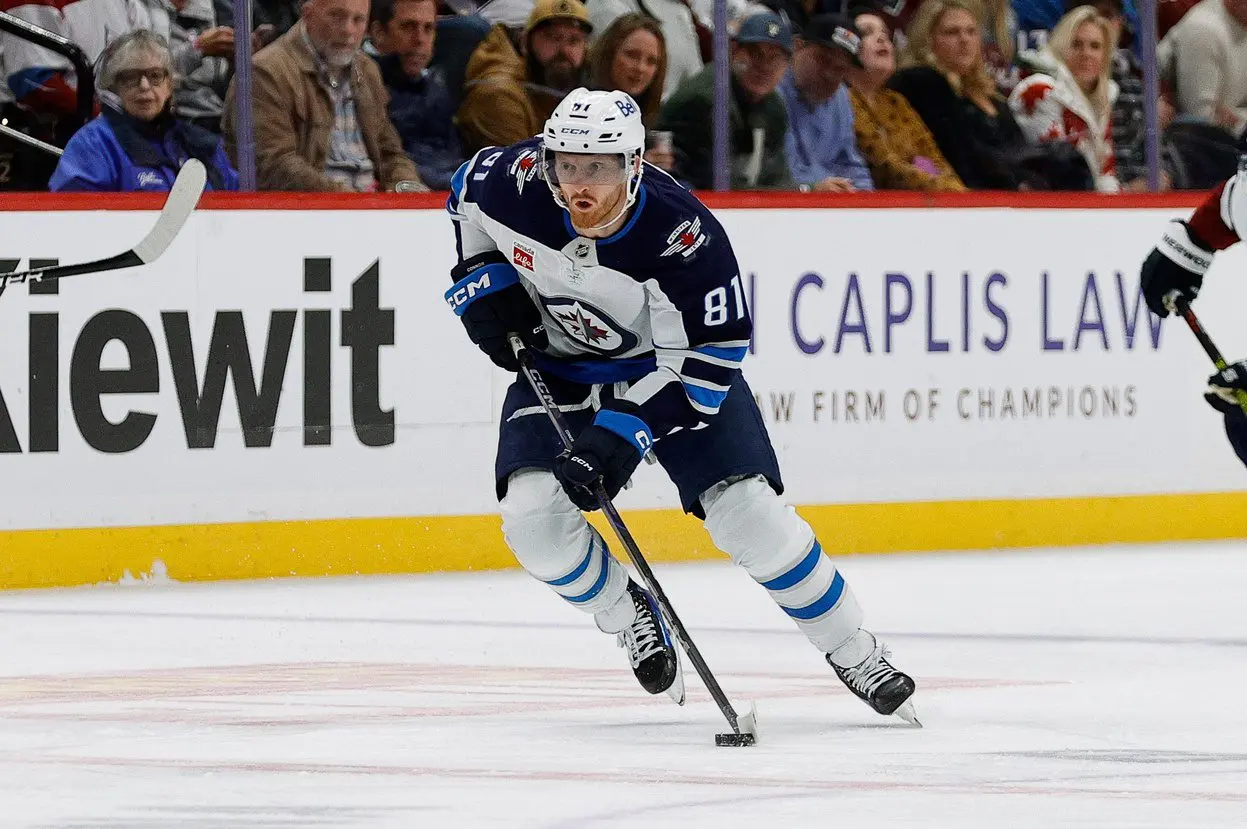 Winnipeg Jets left wing Kyle Connor (81) controls the puck in the first period against the Colorado Avalanche at Ball Arena.