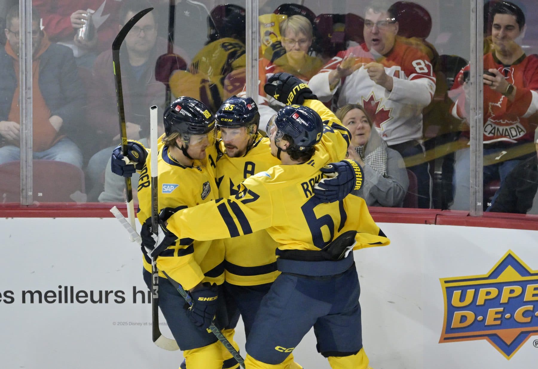 Team Sweden defenseman Erik Karlsson (65) celebrates with teammates including forward William Nylander (88) after scoring a goal against Team Finland in the second period during a 4 Nations Face-Off ice hockey game at the Bell Centre