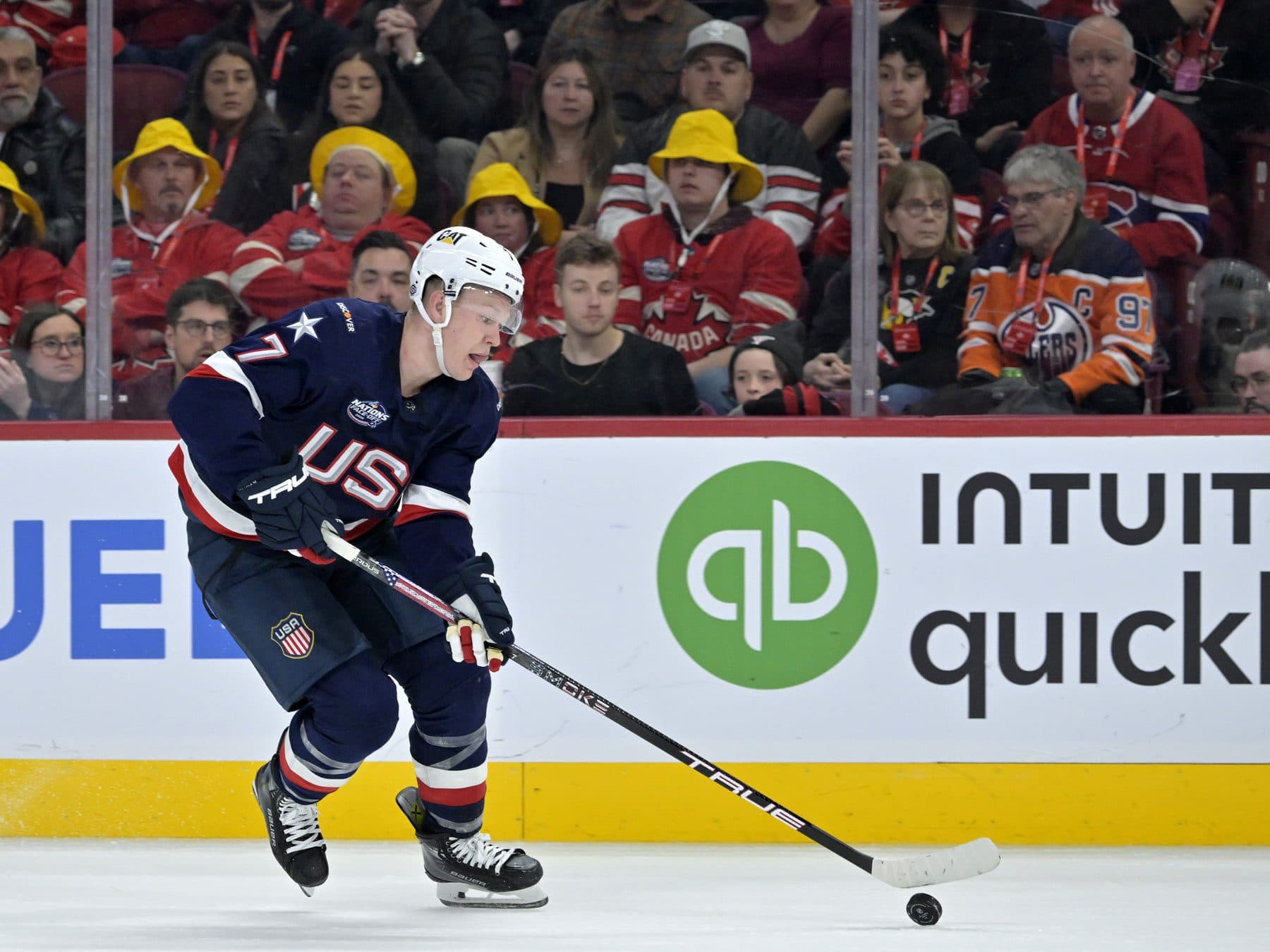 Team United States forward Brady Tkachuk (7) plays the puck against Team Canada in the third period during a 4 Nations Face-Off ice hockey game at the Bell Centre.