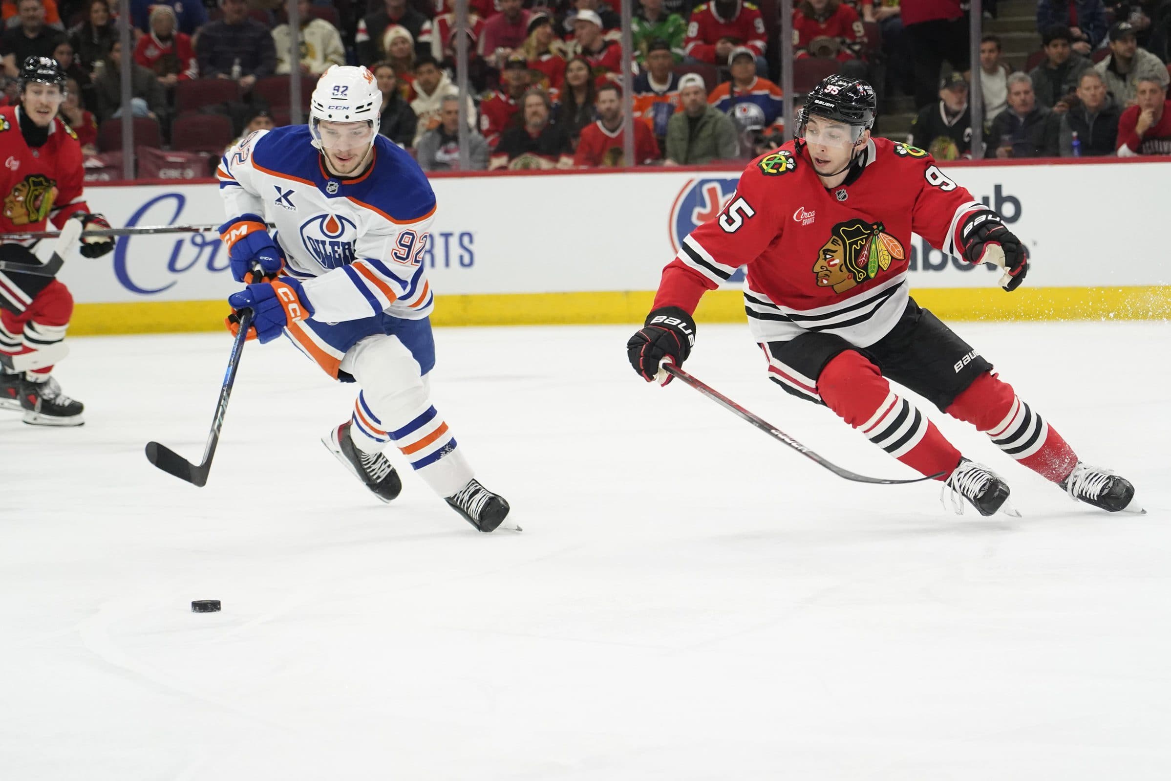 Edmonton Oilers right wing Vasily Podkolzin (92) and Chicago Blackhawks right wing Ilya Mikheyev (95) go for the puck during the first period at United Center.