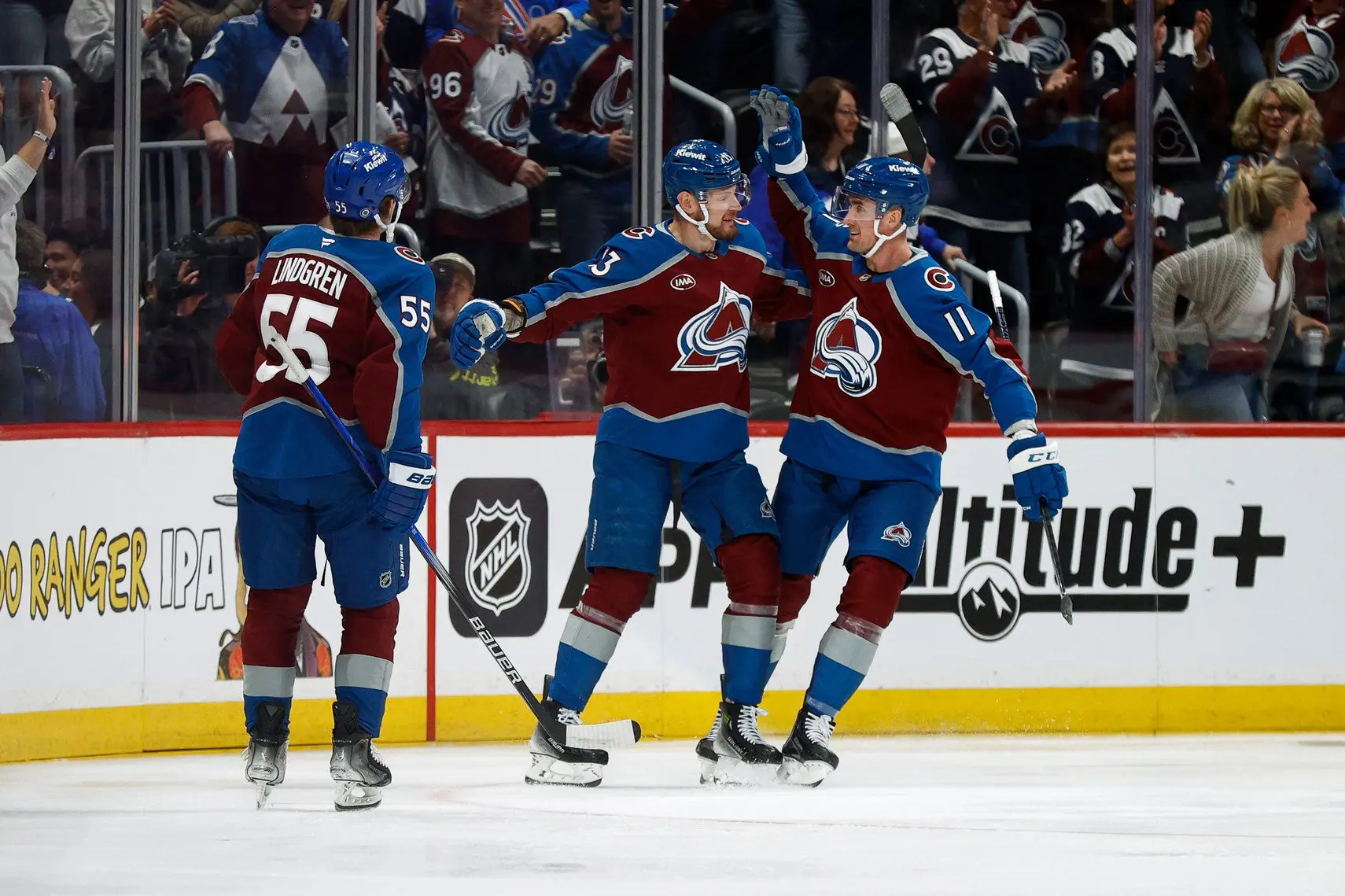 Colorado Avalanche right wing Valeri Nichushkin (13) celebrates his goal with center Brock Nelson (11) and defenseman Ryan Lindgren (55) in the first period against the Toronto Maple Leafs at Ball Arena.