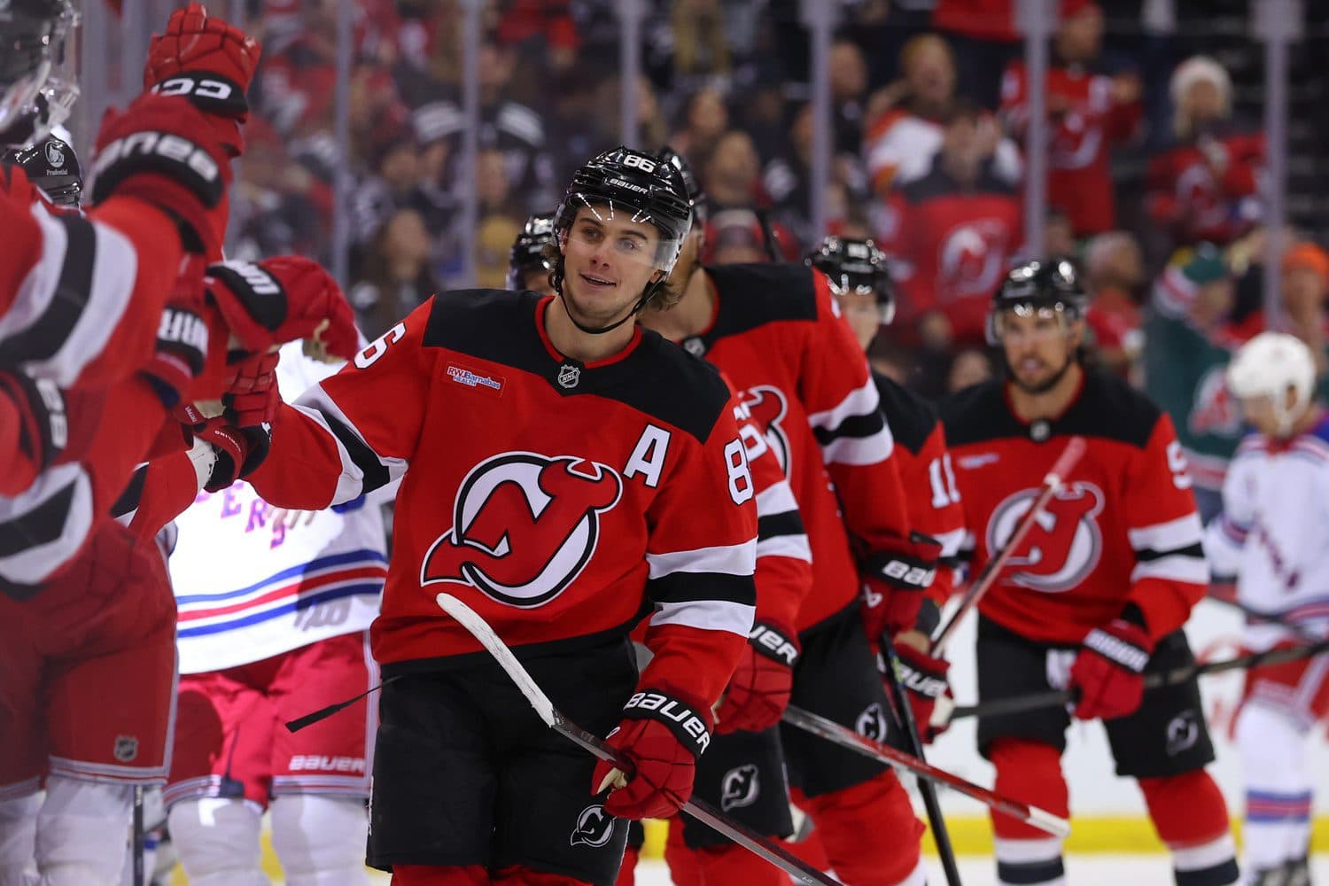 New Jersey Devils center Jack Hughes (86) celebrates his goal against the New York Rangers during the first period at Prudential Center.