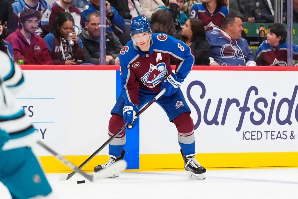 Nov 26, 2025; Denver, Colorado, USA; Colorado Avalanche defenseman Cale Makar (8) controls the puck in the second period against the San Jose Sharks at Ball Arena.