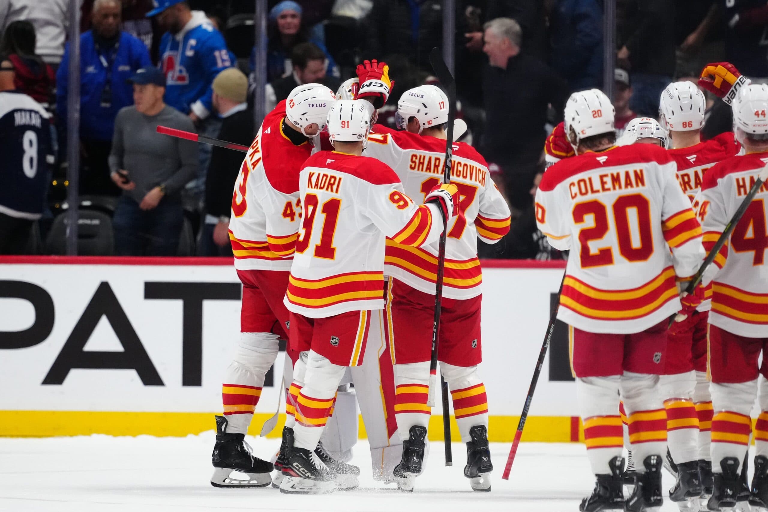 Members of the Calgary Flames celebrate the shoot out win against the Colorado Avalanche at Ball Arena.
