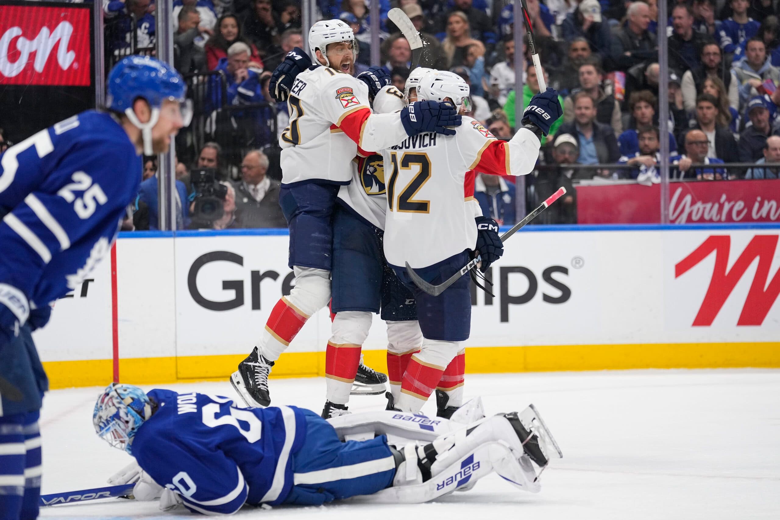 May 18, 2025; Toronto, Ontario, CAN; Florida Panthers forward A.J. Greer (10) celebrates a goal by forward Jonah Gadjovich (12) as Toronto Maple Leafs goaltender Joseph Woll (60) lies on the ice during the second period of game seven of the second round of the 2025 Stanley Cup Playoffs at Scotiabank Arena. Mandatory Credit: John E. Sokolowski-Imagn Images