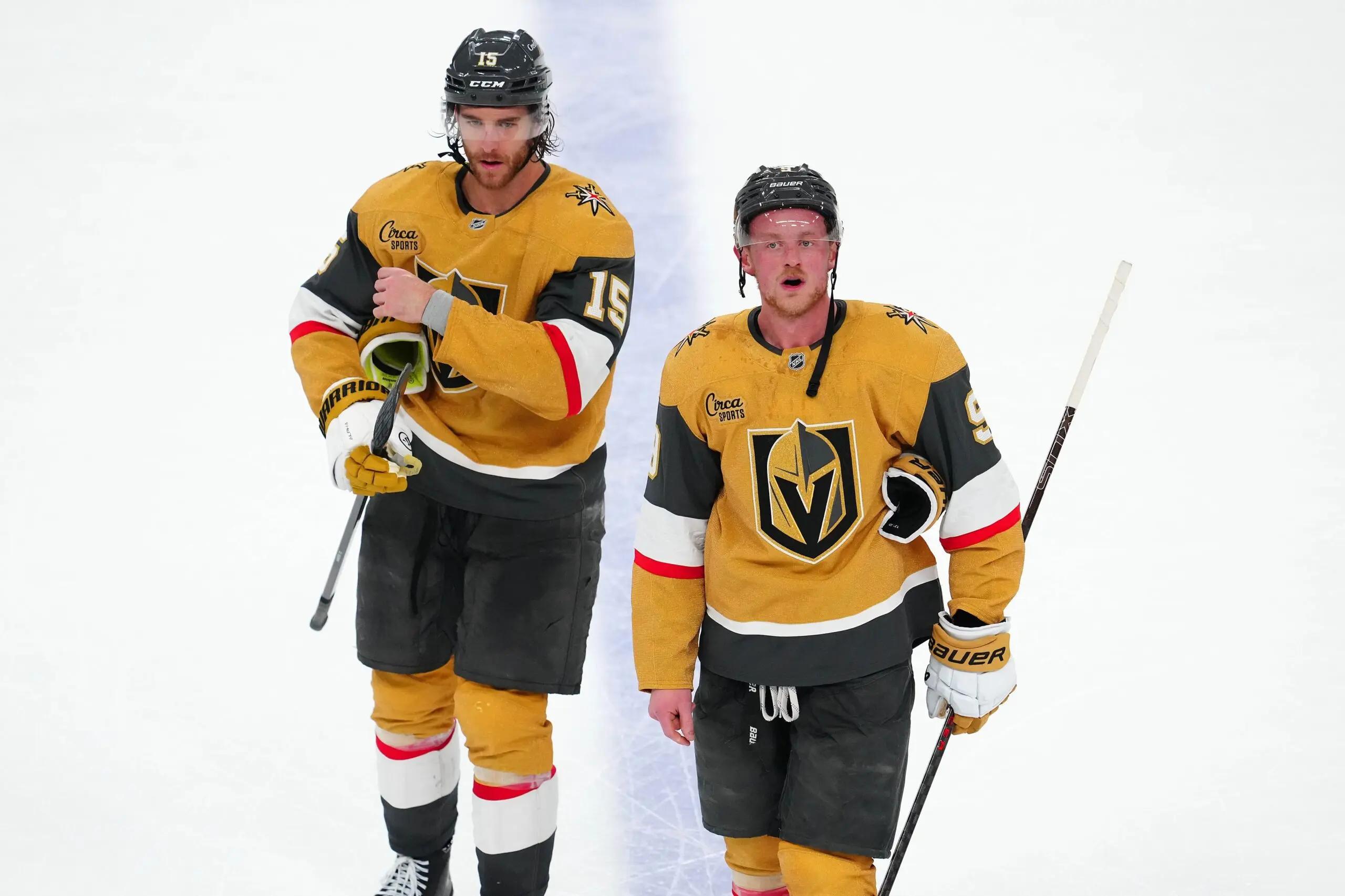 Vegas Golden Knights defenseman Noah Hanifin (15) and center Jack Eichel (9) leave the ice after the Edmonton Oilers defeated the Golden Knights 5-4 in overtime of game two of the second round of the 2025 Stanley Cup Playoffs at T-Mobile Arena.