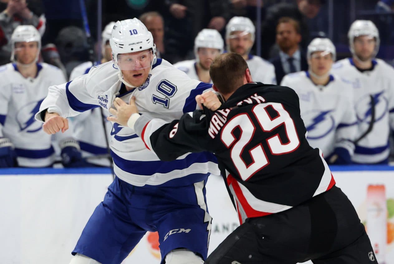 Tampa Bay Lightning right wing Corey Perry (10) and Buffalo Sabres left wing Beck Malenstyn (29) fight during the second period at KeyBank Center.