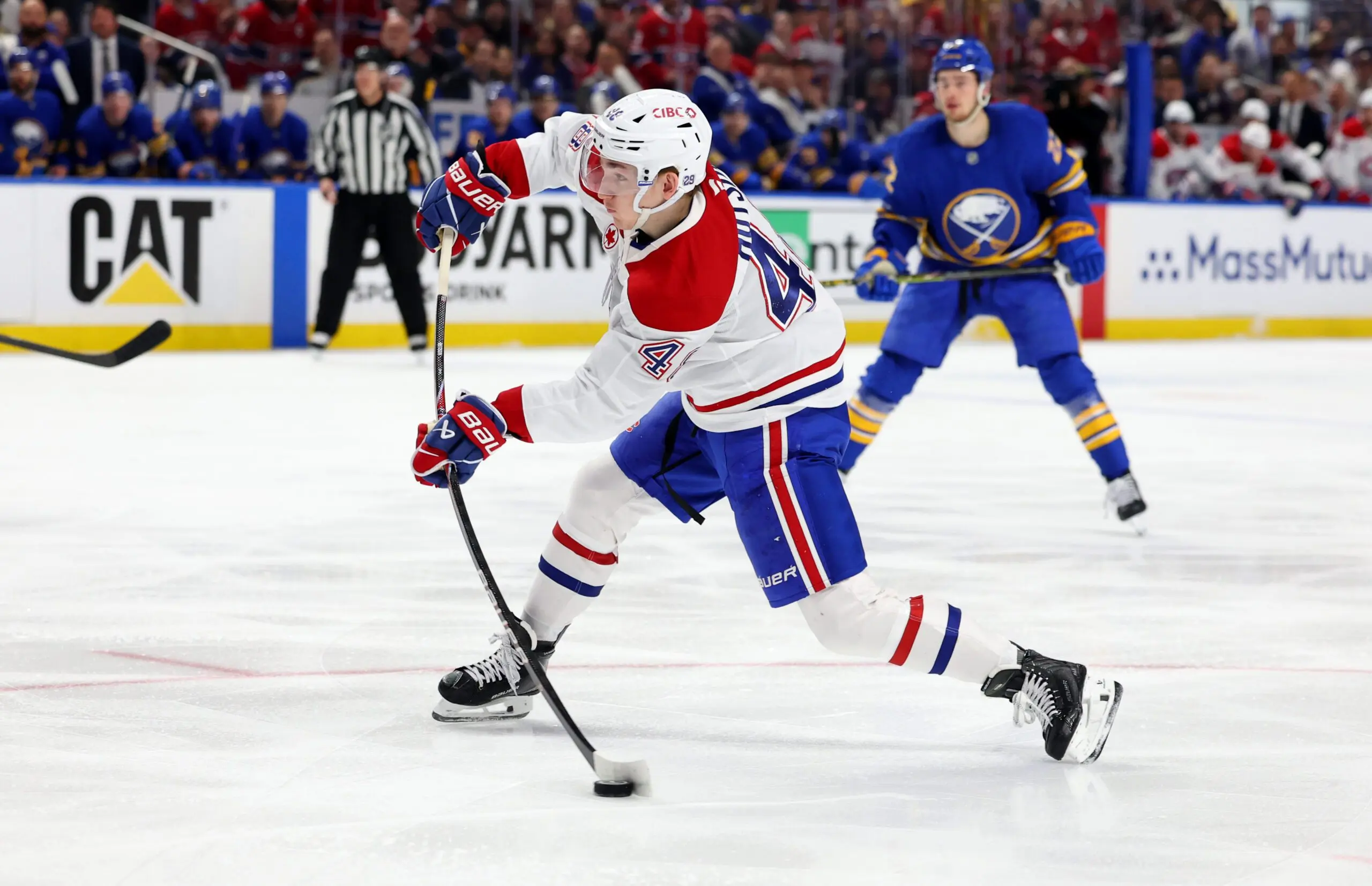 Montréal Canadiens defenseman Lane Hutson (48) takes a shot on goal during the first period against the Buffalo Sabres in game one of the second round of the 2026 Stanley Cup Playoffs at KeyBank Center.